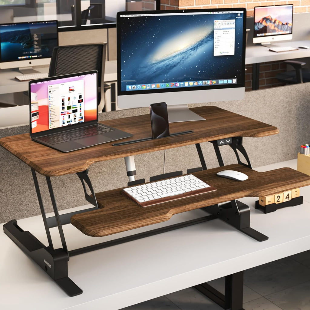 Mount-It! Electric Standing Desk Converter with 38' Tabletop, Height Adjustable Desk Riser, Motorized Desk Riser with Keyboard Tray and Device Slot, Fits Monitor & Laptop, Dark Walnut